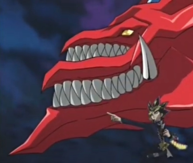 Nome da carta: Slifer, o Dragão Celeste - O deus egípcio controlado por Yugi é Slifer, um dragão vermelho gigantesco com duas bocas. Seu poder de ataque é baseado no número de cartas na mão de quem o usa vezes mil. Ou seja, com cinco cartas na mão, Slifer terá um poder de ataque de 5000!