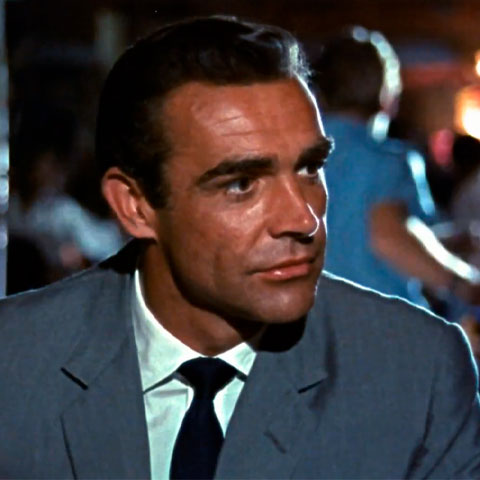 "007" é sucesso mundial desde o primeiro filme em 1962, estrelado por Sean Connery. Em  "007 Contra o Satânico Dr. No" , pela primeira vez o agente fala a clássica frase de apresentação.  Após ganhar um jogo de cartas em um cassino,ele é apresentado para a Bond Girl Sylvia Trench e diz "Bond, James Bond". 
