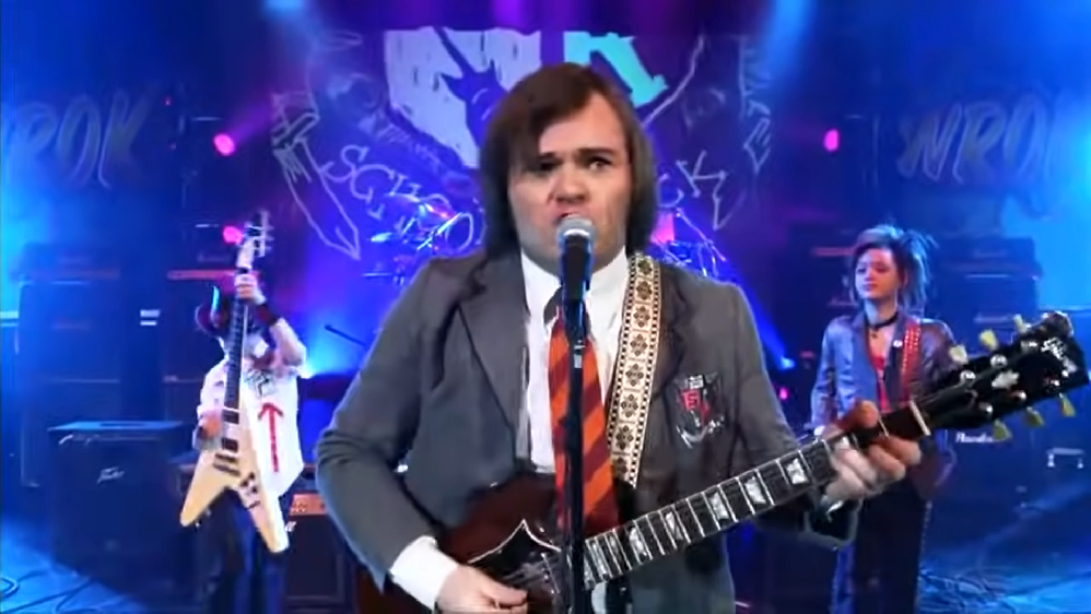 Com a Tenacious D, o ator também ganhou um Grammy e lançou os álbuns Tenacious D, The Pick of Destiny, Rize of the Fenix e Post-Apocalypto. - Reprodução / Escola de Rock