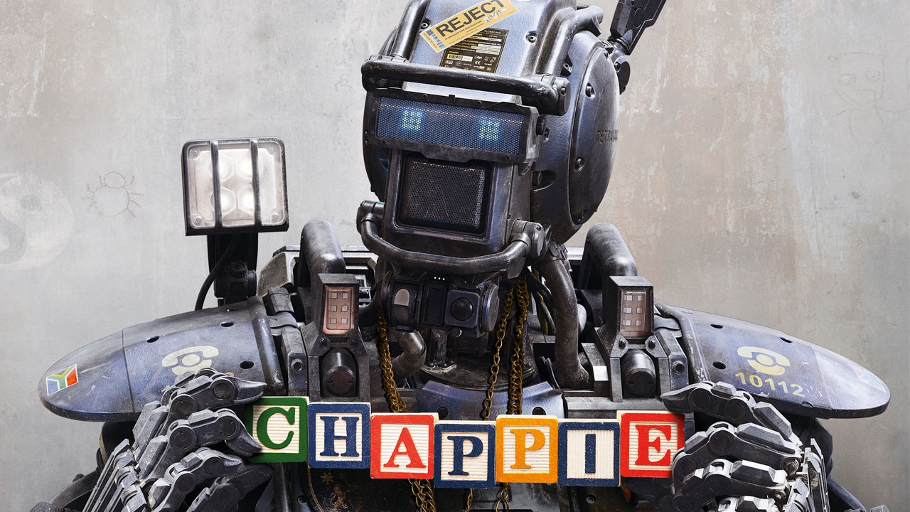 Chappie (2015) – Dir: Neill Blomkamp
Chappie é um robô policial que ganha consciência e passa a aprender sobre a vida com seus criadores. Estrelado por Sharlto Copley (voz e captura de movimento), Dev Patel e Hugh Jackman, o filme explora o crescimento de um robô em um mundo hostil e violento. - 