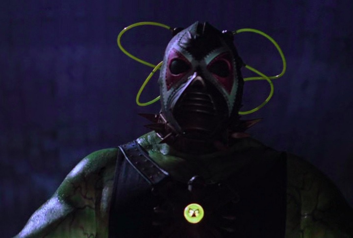 Bane: Famoso por ter conseguido "quebrar" o Batman nas HQs, o vilão Bane teve sua estreia nas telonas em "Batman e Robin", de 1997, com o ator Jeep Swenson. O filme foi tão mal nas avaliações que pouca gente se lembra dessa versão... - reprodução
