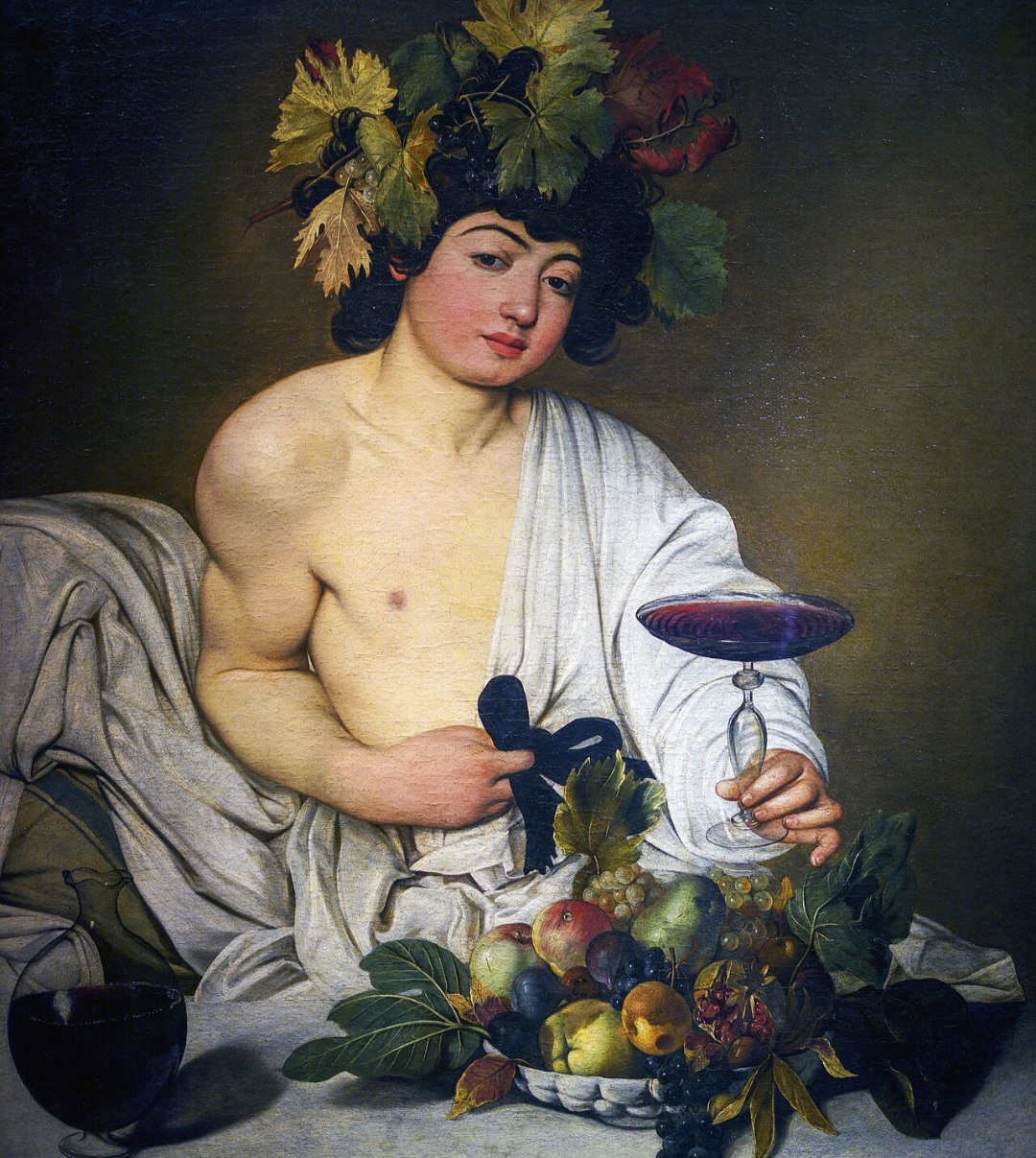 “Baco” de Caravaggio, criado em 1597 no estilo barroco, representa o deus do vinho em cena naturalista. A obra se destaca pela intensidade da luz e representação do corpo jovem.-Domínio público 