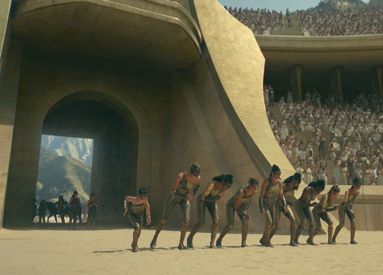 A ilha de Temiscira, lar das Amazonas e de Diana, representa um paraíso isolado, onde as mulheres treinam como guerreiras, vivem em harmonia e são preparadas para proteger o mundo externo.