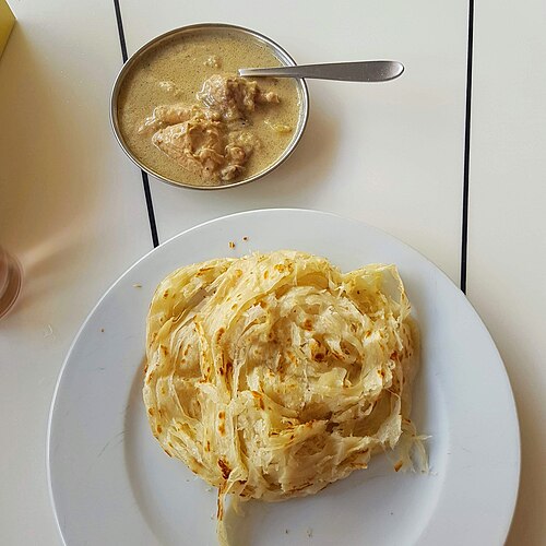 5Âº lugar â?? Parotta (Ãndia). PÃ£o folhado de rua, feito com massa laminada manualmente em vÃ¡rias camadas e frita na chapa, famoso pela textura macia e levemente crocante.