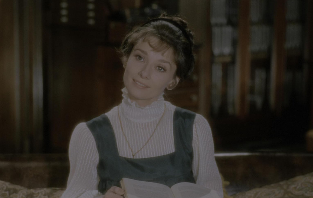 <p>Foi nesse ponto da carreira que Hepburn deixou para trás a imagem de ingénua e passou a interpretar personagens mais experientes, assim, um de seus papéis mais controversos foi o de Eliza Doolittle. Embora tenha entregue uma atuação consistente como a florista transformada em dama elegante, parte do público teve dificuldade em aceitá-la no papel, que muitos associavam a Julie Andrews, intérprete original nos palcos.</p>
